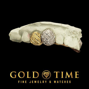 Two-tone double cap grillz on a dental mold: a yellow gold cap and a white gold cap, both with trillion diamond cuts and a dust finish