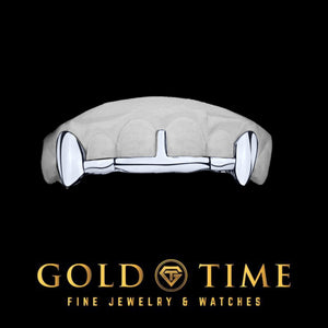 White fang grillz with solid canine fangs, a slim tip bar along the front teeth, and a center gap bar, on a dental mold