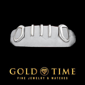 White five piece grill with open face canines and three gap bars on a dental mold
