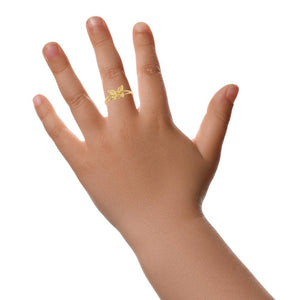 Butterfly ring worn on a child's finger