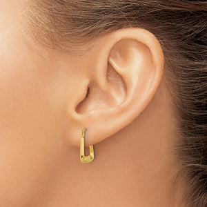 Small yellow gold square hoop earring worn on an ear