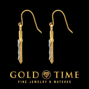 Side view of the two-tone crucifix earrings