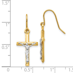 Crucifix earrings next to a ruler, about 1 inch long