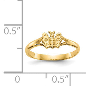 Yellow gold baby butterfly ring next to a ruler for size