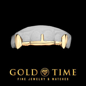 Yellow fang grillz with solid canine fangs, a slim tip bar along the front teeth, and a center gap bar, on a dental mold