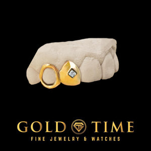 Yellow gold double cap grillz on a dental mold: an open face canine beside a solid cap set with a clear princess cut moissanite