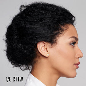 Woman wearing a 1/6 cttw diamond flower cluster stud earring