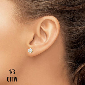 Ear wearing a 1/3 cttw diamond flower cluster stud earring