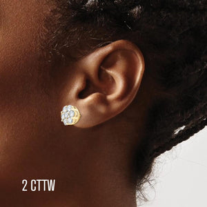 Ear wearing a 2 cttw diamond flower cluster stud earring