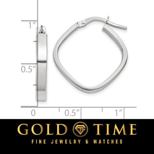 White gold rounded square hoop earring against an inch ruler