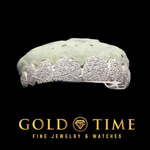 Front view of white 10 piece star cluster moissanite grillz with scalloped perm cut edges on a dental mold