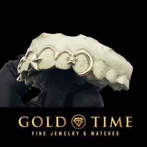 Angled view of silver frameless star grillz on a mold, with a 3D star and hooked outline at the end tooth