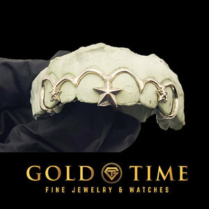 Front view of silver frameless open face grillz on a mold with a sculpted 3D star between the front teeth