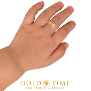 Hibiscus flower ring worn on a child's finger