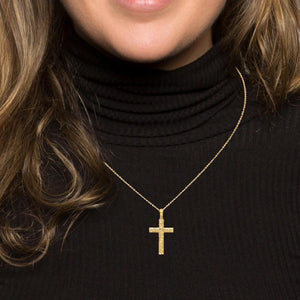 Nugget cross pendant worn on a chain, chain sold separately