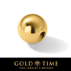 Close-up of a polished 14K gold spacer bead