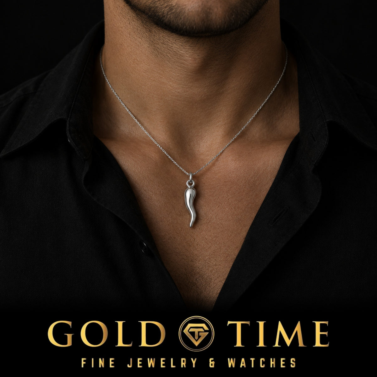 Man in an open-collar black shirt wearing the sterling silver Italian horn cornicello charm on a silver chain, Gold Time