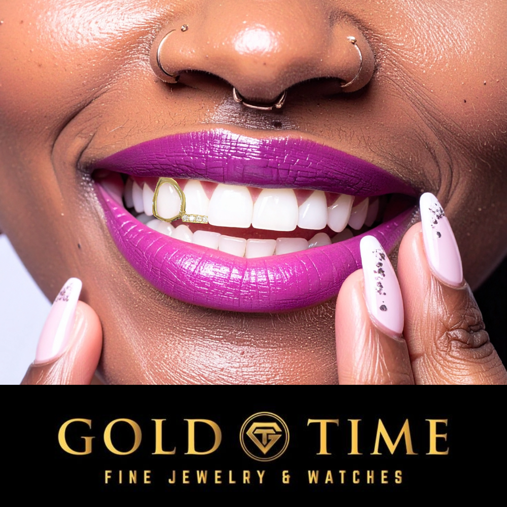 Close-up of a smiling person wearing bright magenta lipstick and light pink manicured nails, with gold nose rings visible on the nose. A black banner at the bottom reads 'GOLD TIME FINE JEWELRY & WATCHES'.