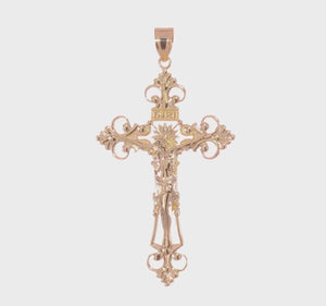 Video of the large gold INRI fleur de lis crucifix pendant turning in the light