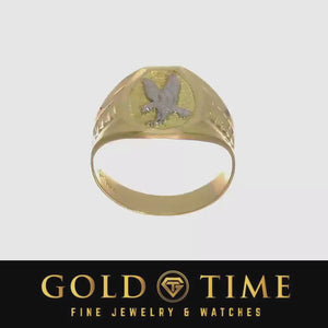 Video of a men's two-tone gold eagle signet ring rotating to show the eagle face and tapered band