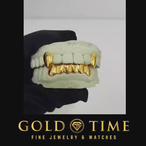 Video of the gold solid fang grillz turning on a dental model
