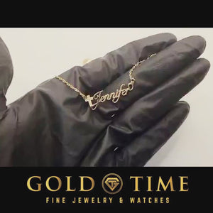 Video of the yellow gold Cross Luxe script name necklace reading Jennifer turning in the light