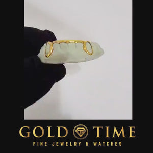 Video of 6 piece bottom open face grillz with spike tips shown on a dental mold