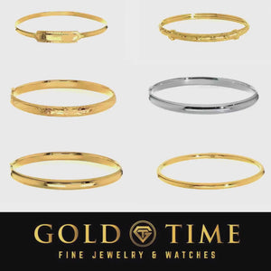 Video of six 14k gold baby and children's bangles, including yellow, white, engraved, and ID plate styles