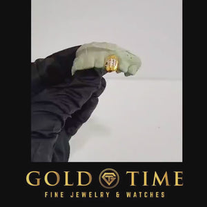 Product video of an engraved single tooth cap grill on a dental mold