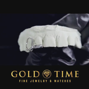Video of the two piece grillz showing the open face canine and the solid incisor tip on a dental mold