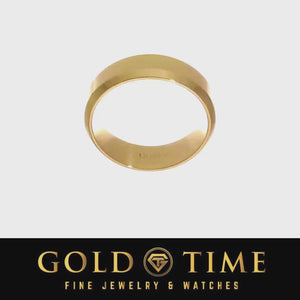 Rotating view of a yellow gold 7mm beveled edge comfort fit wedding band