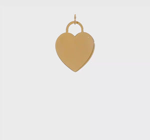 Video of a 14k yellow gold heart disc charm turning to show its polished face and open bail