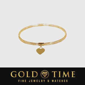 Video of a yellow gold woven mesh stretch bangle with a dangling heart charm
