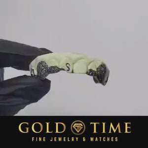 Video of custom 4 piece black trillion dust fang grillz