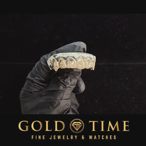 Video of the yellow gold trillion cut tip fang grillz