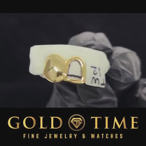 Product video of yellow gold solid canine and open face incisor double cap grillz on a dental mold