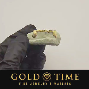 Video of the solid canine and trillion tip bar grillz