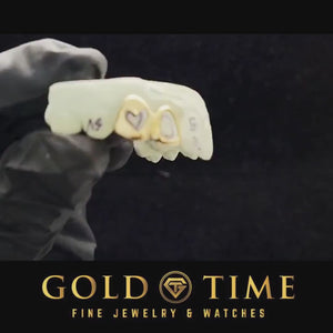 Video of the double cap open face heart cut out grillz on a dental mold