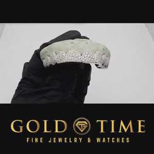 Video of white 10 piece star cluster moissanite grillz on a dental mold held in a gloved hand