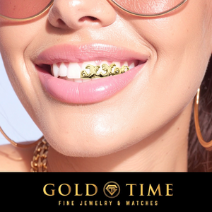Close-up of a smiling woman wearing gold grillz on her teeth, with gold hoop earrings and round sunglasses visible. A black banner at the bottom reads 'GOLD TIME FINE JEWELRY & WATCHES'.